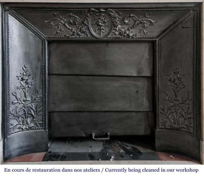 Louis XVI style fireplace with rounded corners and decorated with a laurel wreath, in Carrara marble-11