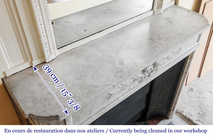 Louis XVI style fireplace with rounded corners and decorated with a laurel wreath, in Carrara marble-12