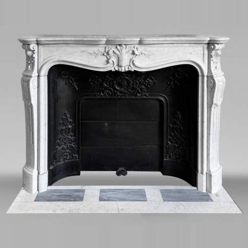 Louis XV style fireplace in Carrara marble, decorated with a palmette