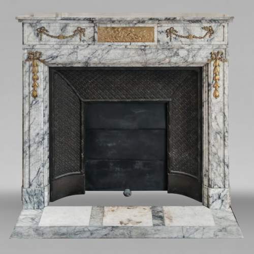 Napoleon III style fireplace in veined granite, with bronze decoration