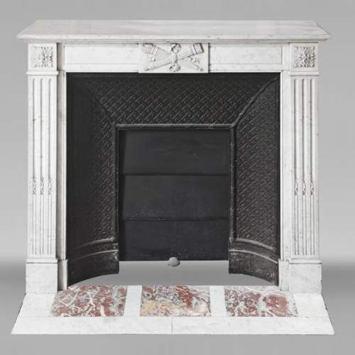 Louis XVI style fireplace in Carrara marble decorated with a torch and a quiver