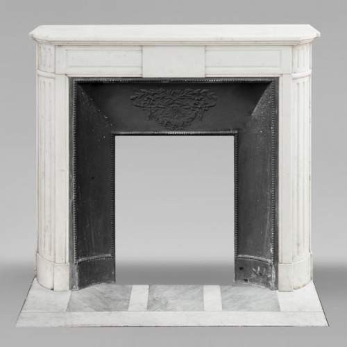 Louis XVI style fireplace with rounded corners in statuary marble