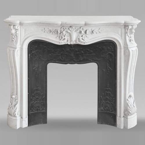Louis XV style fireplace in Carrara marble, with richly sculpted floral decoration