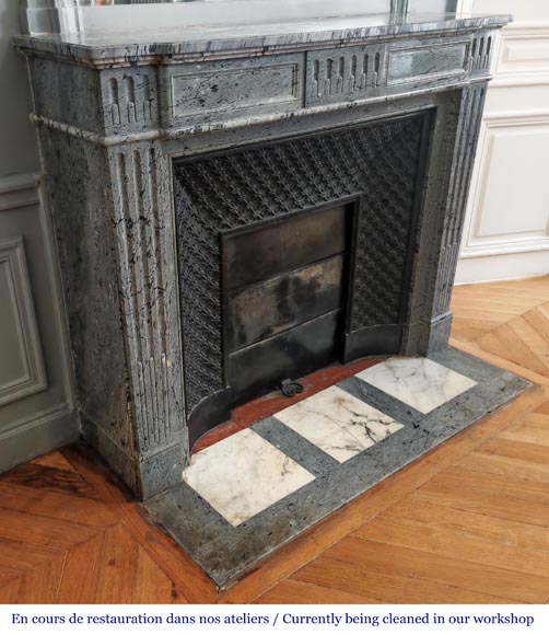  Louis XVI-style fireplace in blue fleuri marble, featuring fluted decoration-1