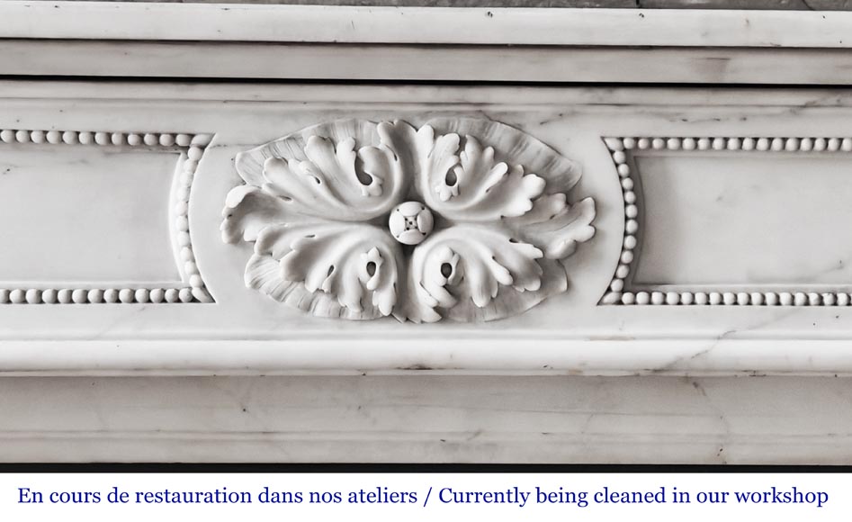 Louis XVI-style statuary marble fireplace featuring acanthus leaf and bead-and-reel motifs-1