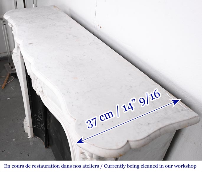 Louis XV-style fireplace in Carrara marble, featuring an asymmetrical palmette motif-14