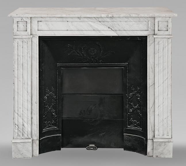 Louis XVI-style fireplace in Carrara marble, featuring molded ornamentation-0