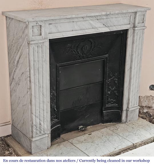 Louis XVI-style fireplace in Carrara marble, featuring molded ornamentation-2